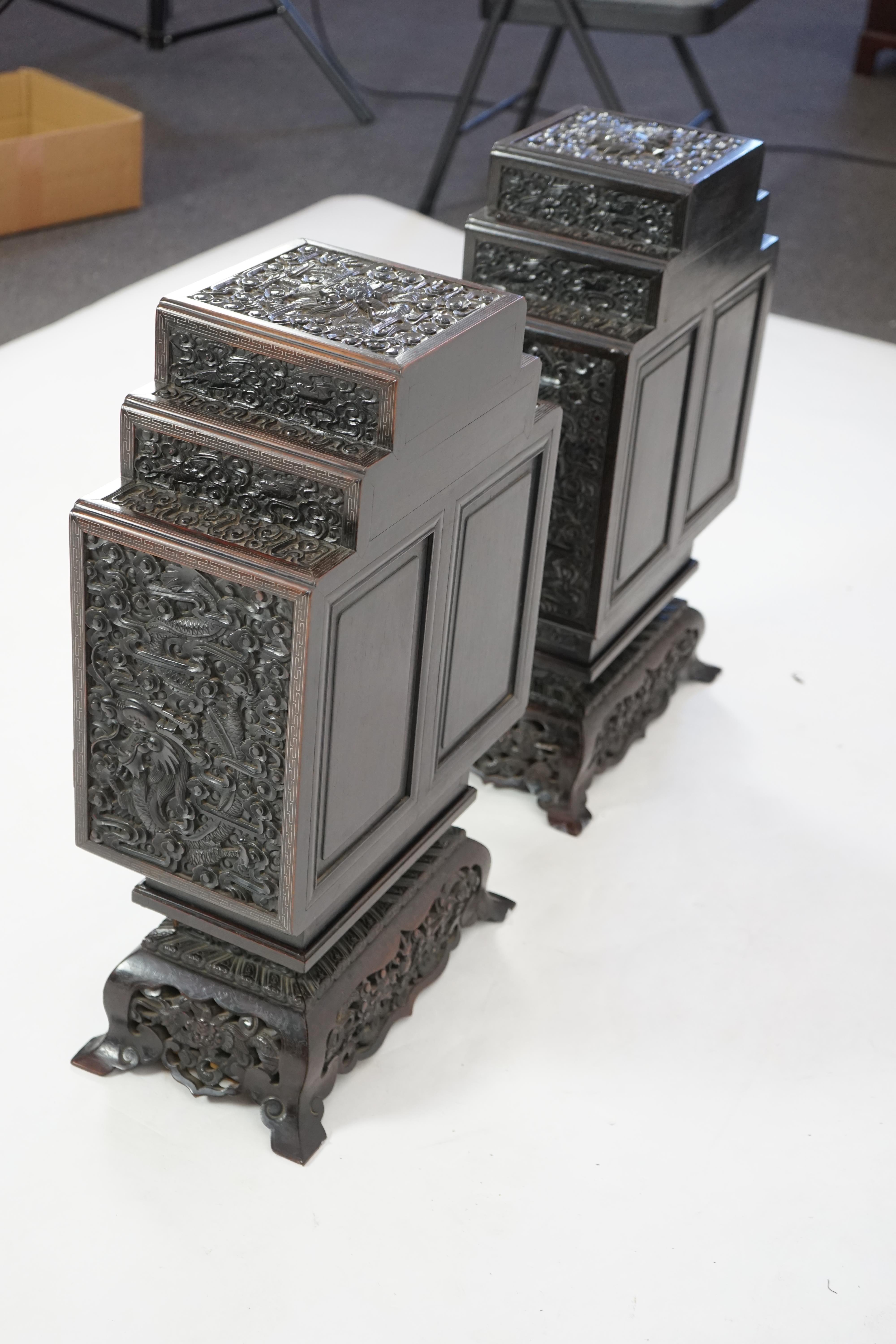 An important pair of Chinese carved zitan and silver wire inlaid ‘cloud and dragon’ curio cabinets and stands, duobaoge, probably Imperial, late Qing dynasty